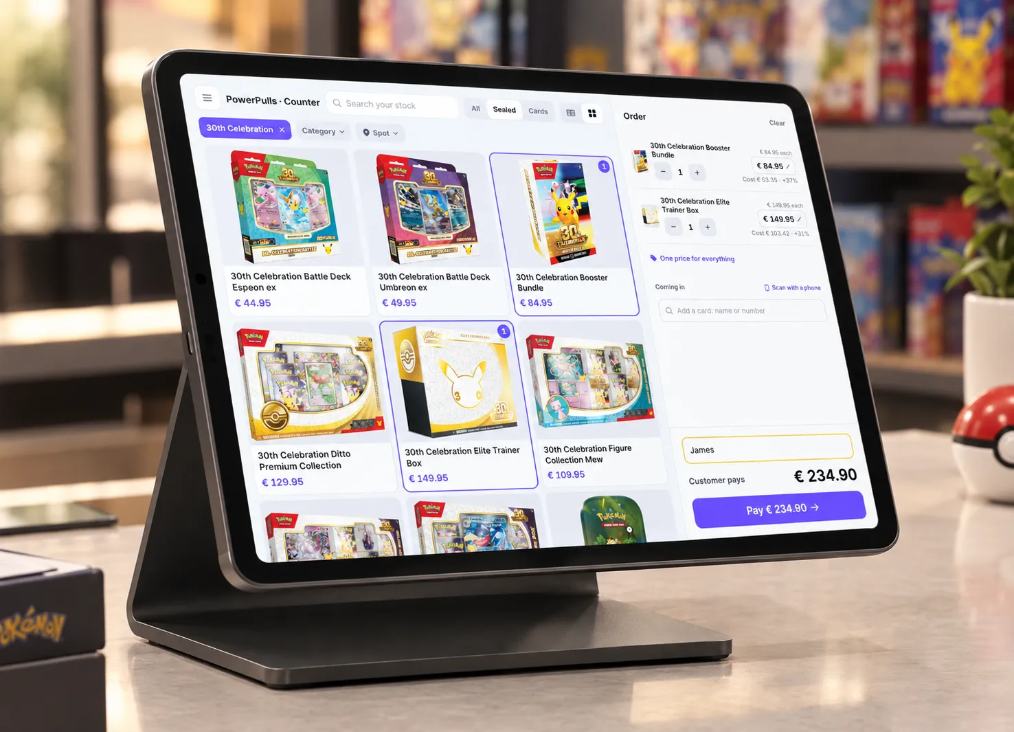 The Ripshop POS on an iPad on a stand in a card shop, with an order and the Pay button on the screen